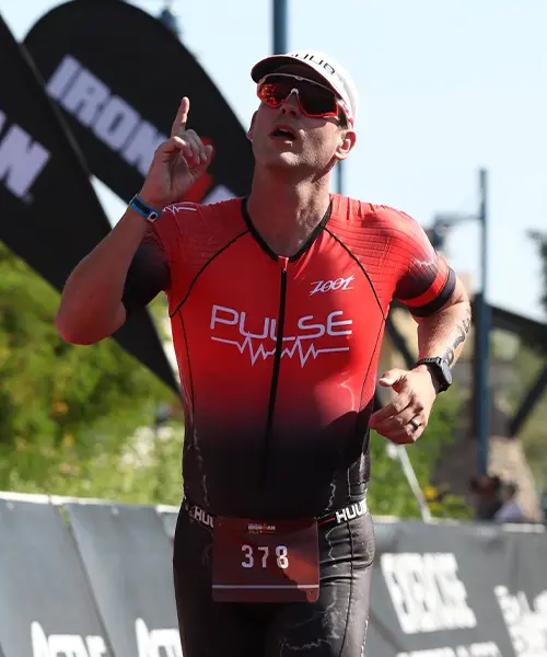 Tim Robertson competing at IRONMAN 70.3 Santa Cruz triathlon finish line